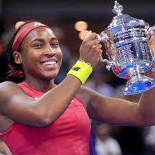 Tennis player holding trophy cup