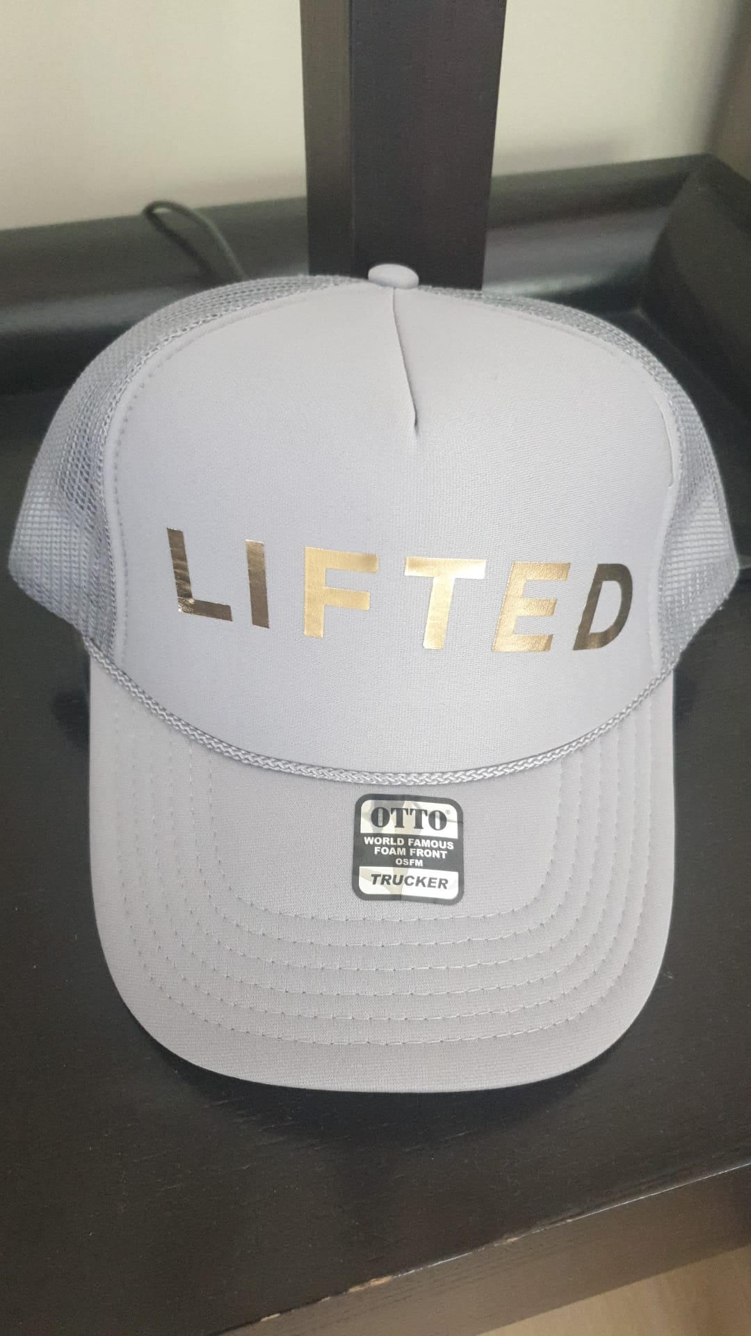 A white cap with Lifted written on it
